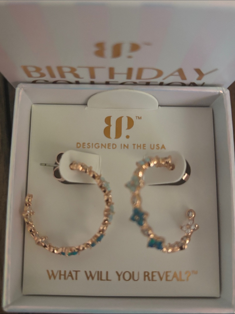 Bomb Party October 2026 Rose Gold Hoop Earrings with Blue Clover Accents
